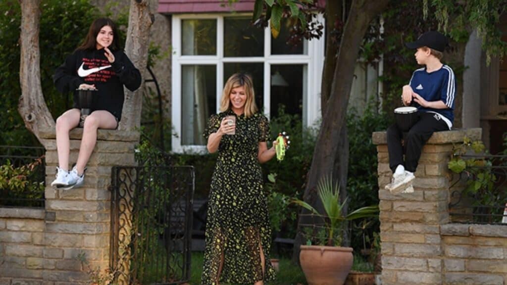 The TV star pictured with Darcey and Billy outside their family home