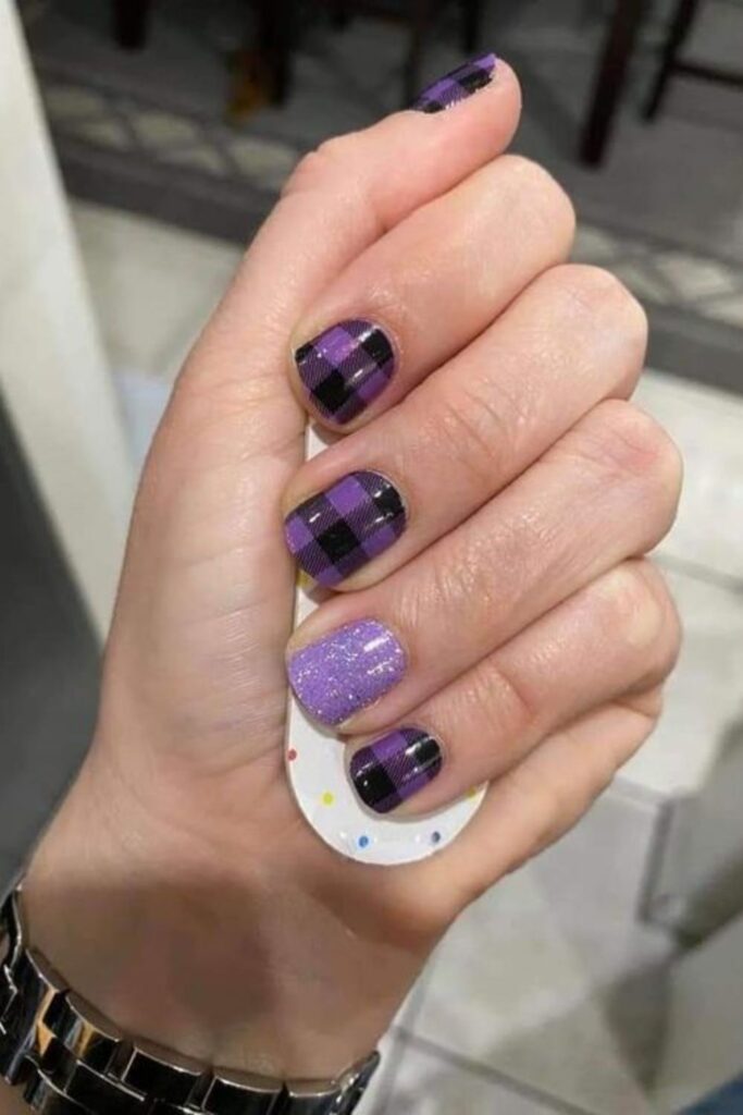 Plaid Over Glittery Purple Nails