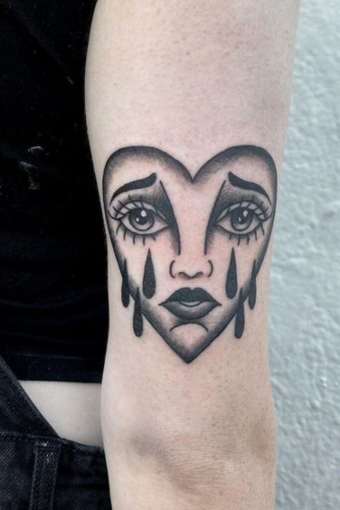 Crying Face Heart Tattoo