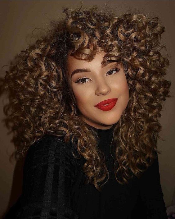 Full Bangs with Voluminous Curls