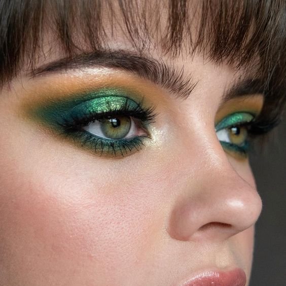 Close-up of emerald green and gold eyeshadow
