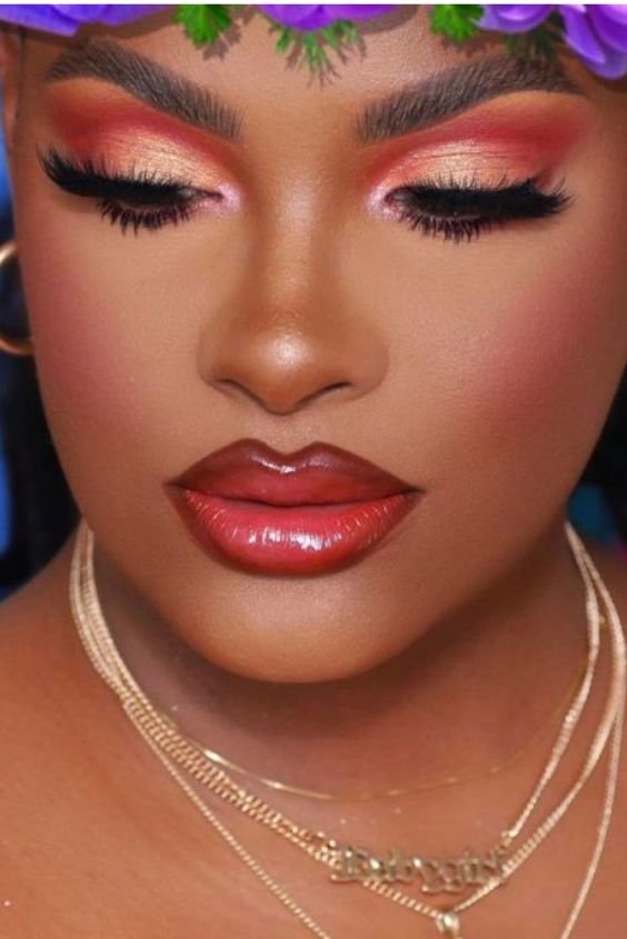 Woman with soft coral eyeshadow and coral lips