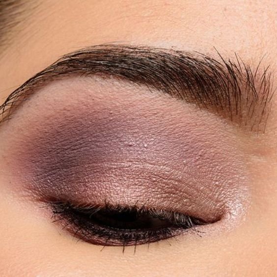 Close-up of a softly blended smoky mauve eye