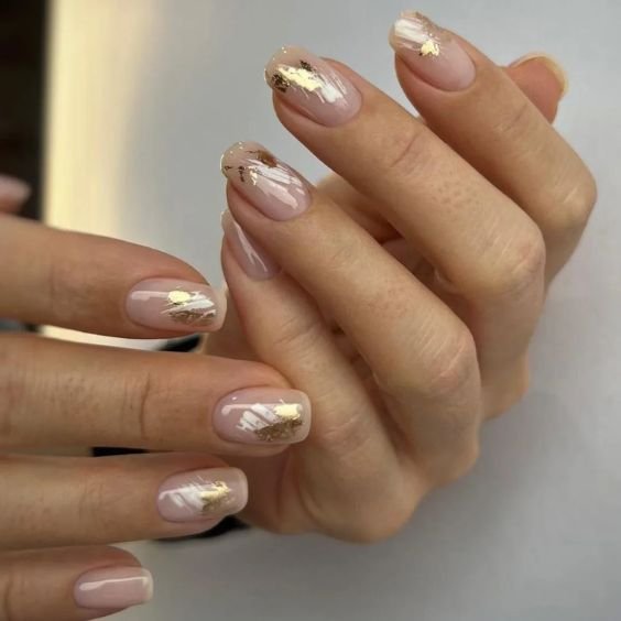 Glossy Nude Short Nails with Gold Foil Accents