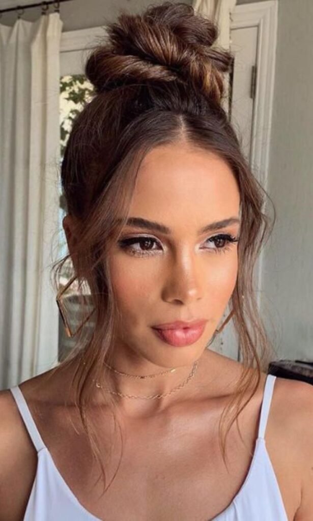 Messy Top Knot with Face-Framing Strands