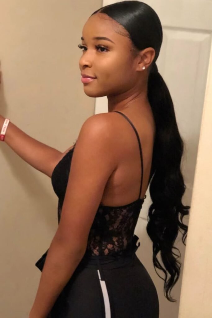 Sleek Low Ponytail with Center Part