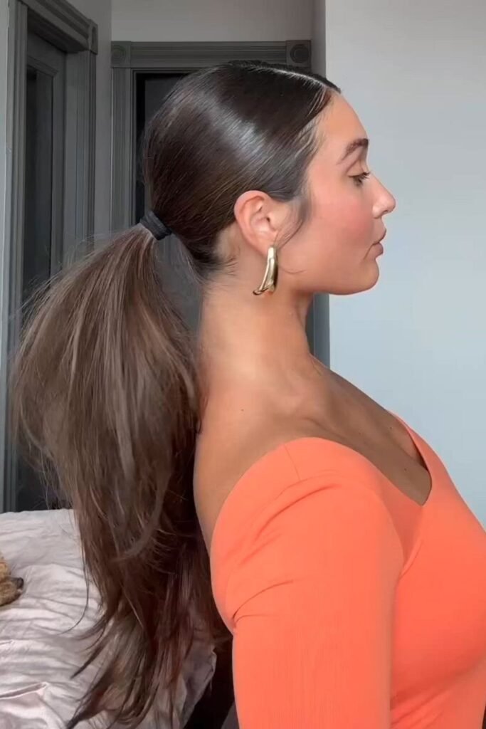 Sleek Low Ponytail with Side Part