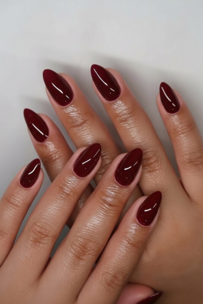Short almond nails in classic deep red