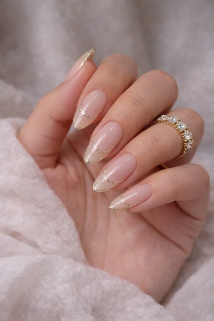 Almond nails with a fine tinsel-style French outline
