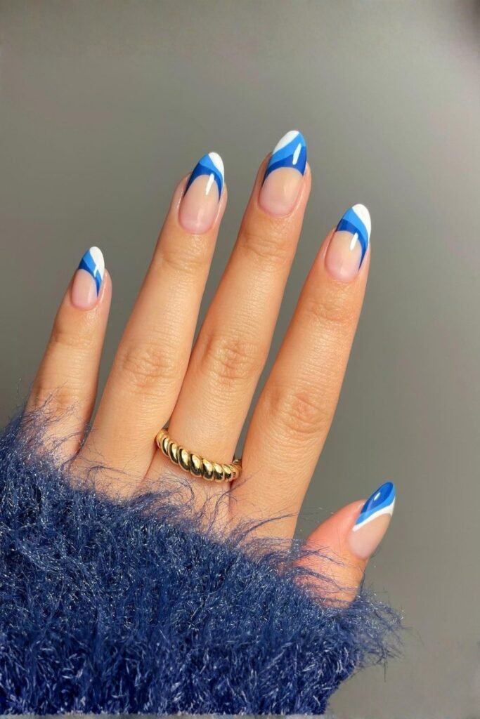Almond nails with abstract blue French tips