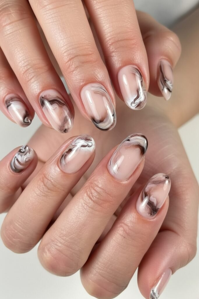 Nude almond nails with smoky black and grey marbled art