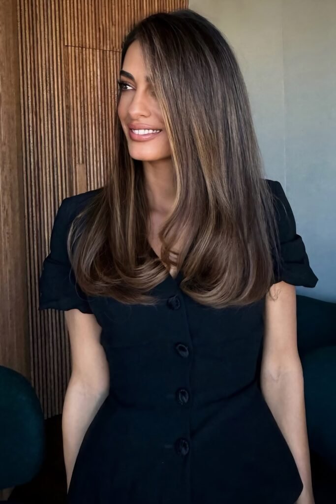 Long brunette hair blown out with rounded ends