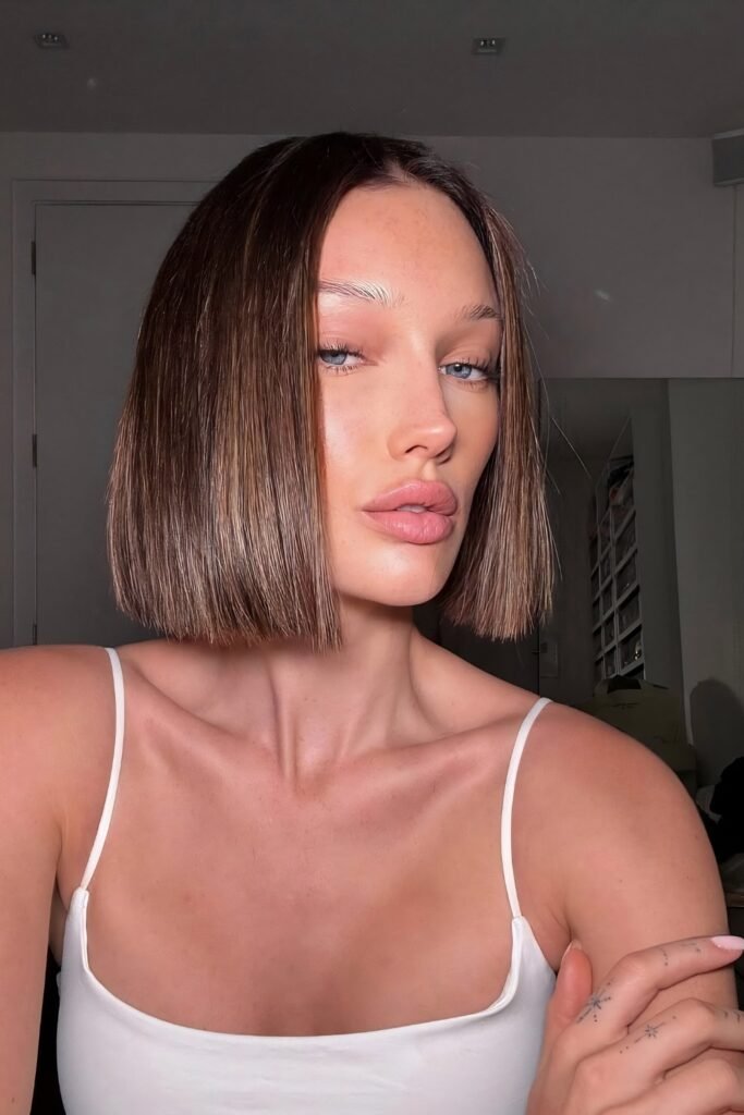 Sleek chin-length bob with a middle part