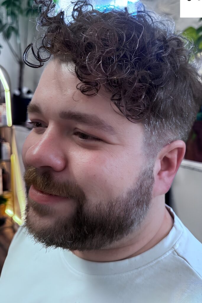Curly Top on a man with a round face