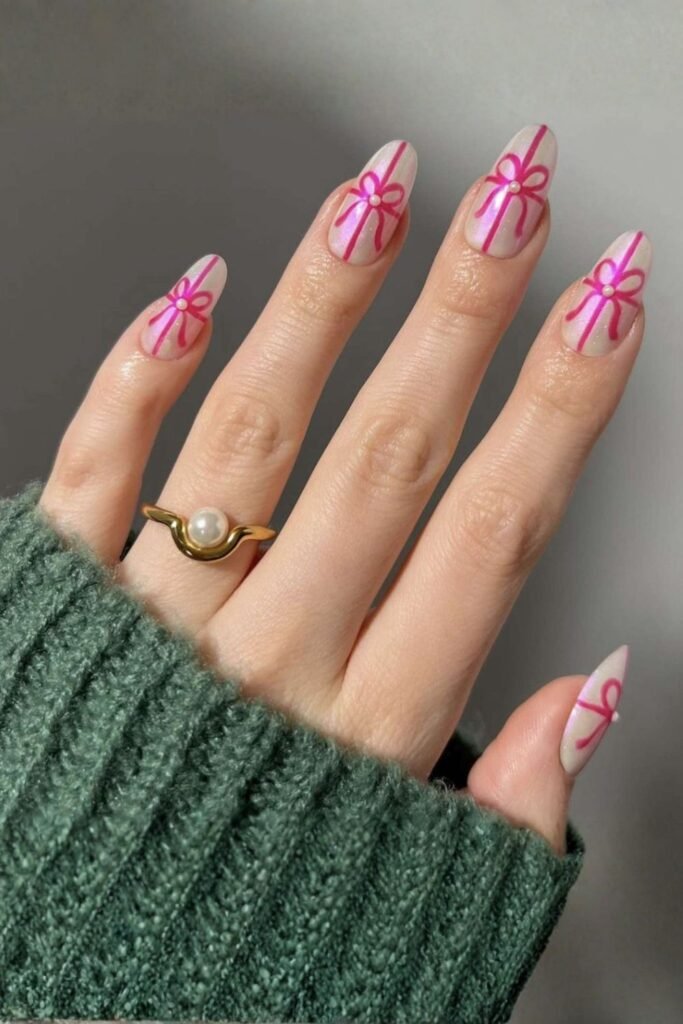 Delicate Bow Accents on Almond Nails