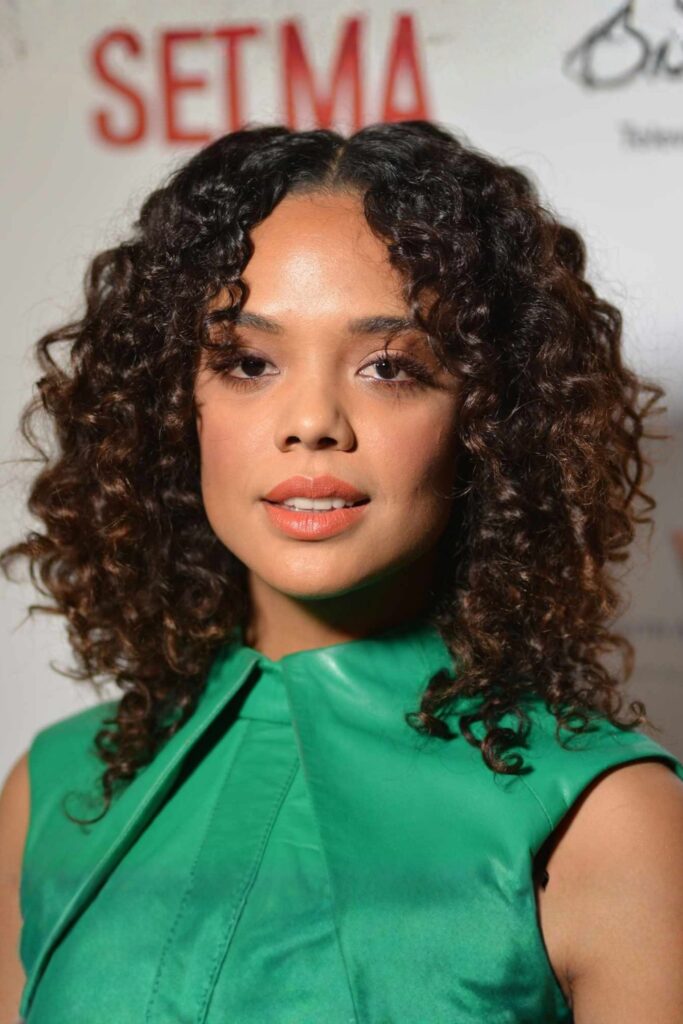 Mid-Length Curly Cut with Side Bangs