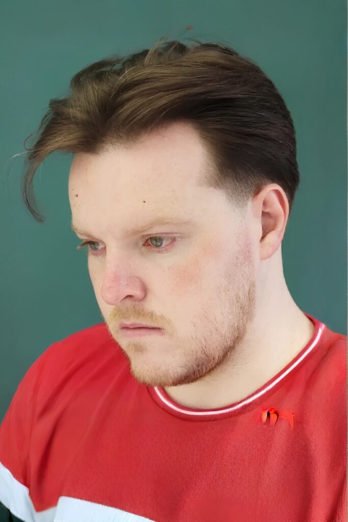 Neat Middle-Part Haircut on a man with a round face