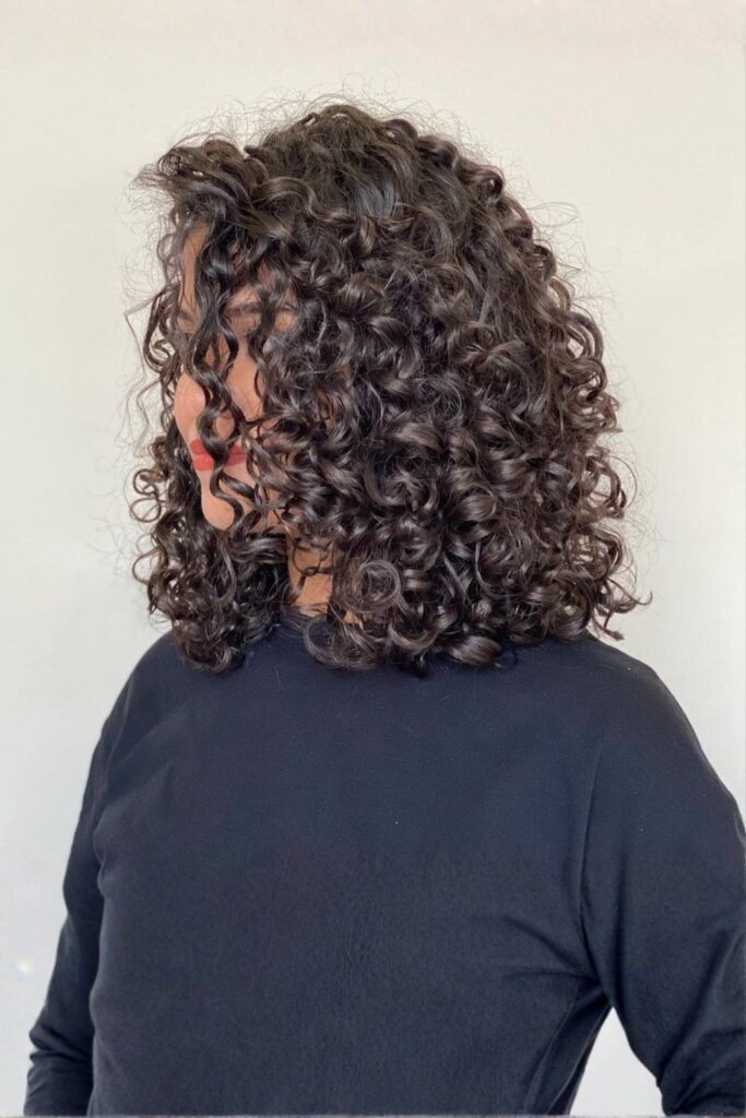 Shoulder-Length Defined Coils with Side Shape