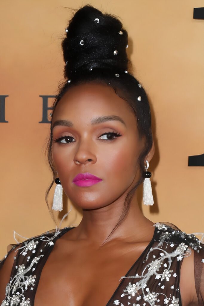 Woman with a high top knot decorated with jewels
