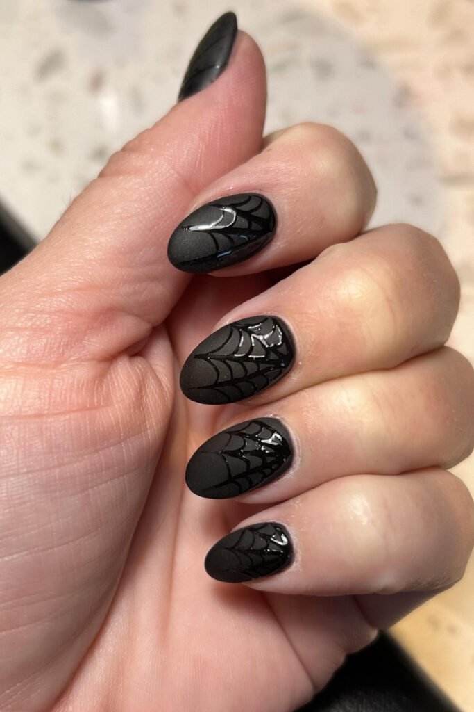 Black Glossy Nails with Subtle Spiderweb Details