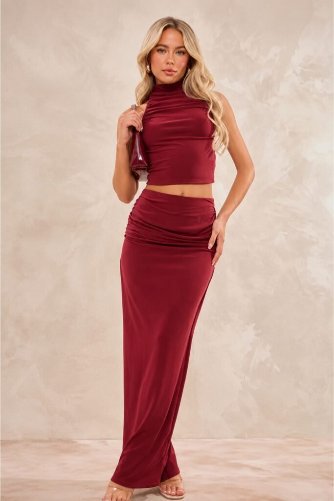 Woman in a burgundy ruched maxi skirt and matching top