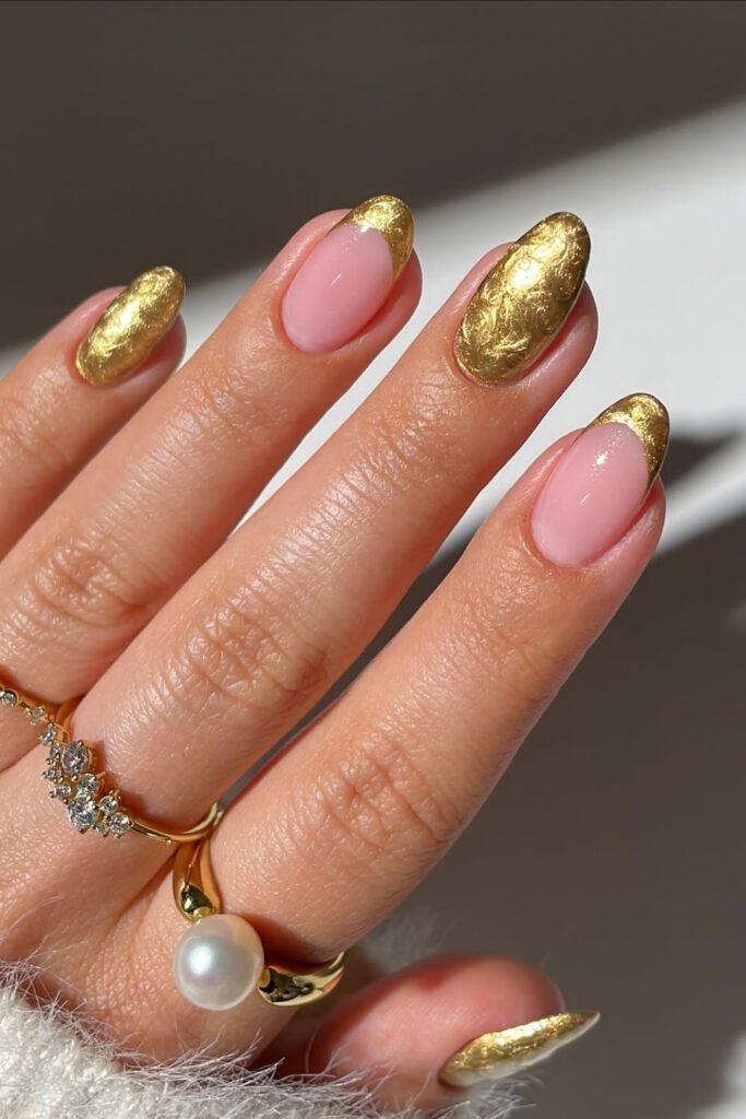 Nude nails with gold foil and a gold chrome accent