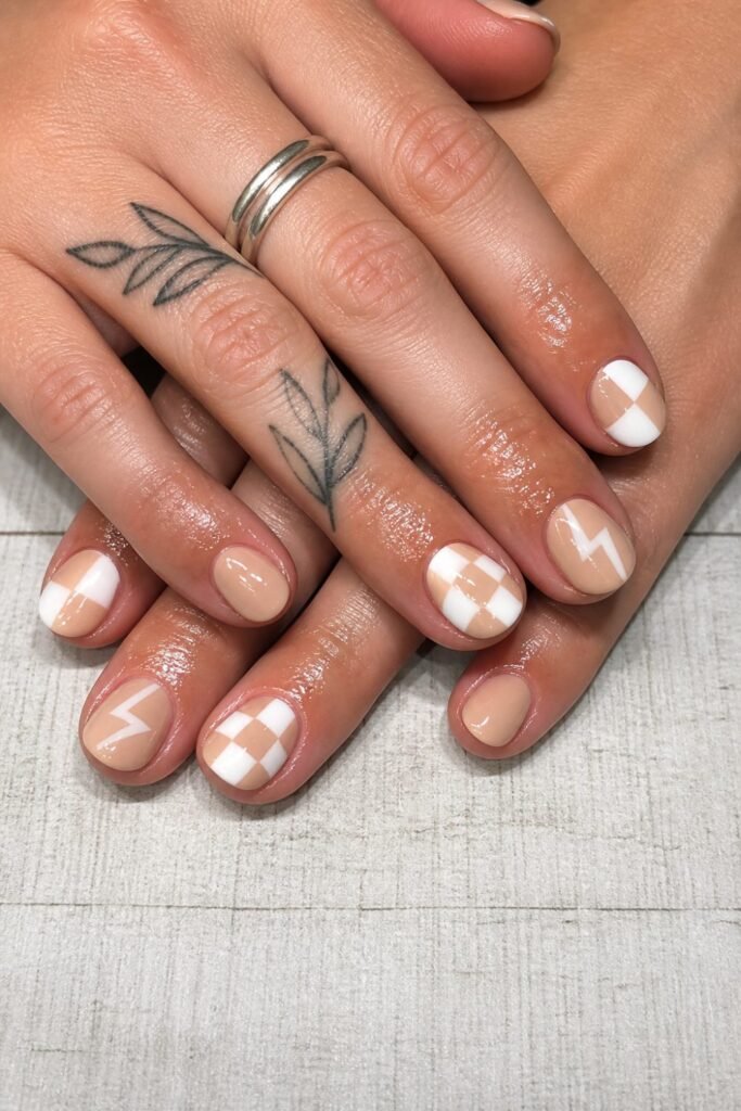 Short nude nails with small plaid accents