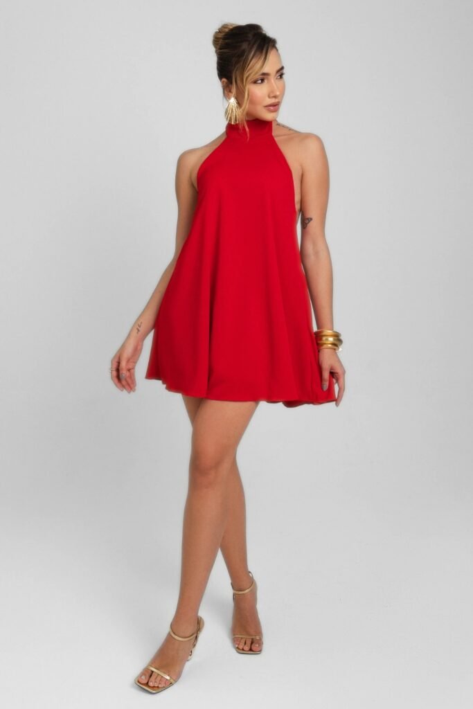 Woman in a red high-neck puffball mini dress