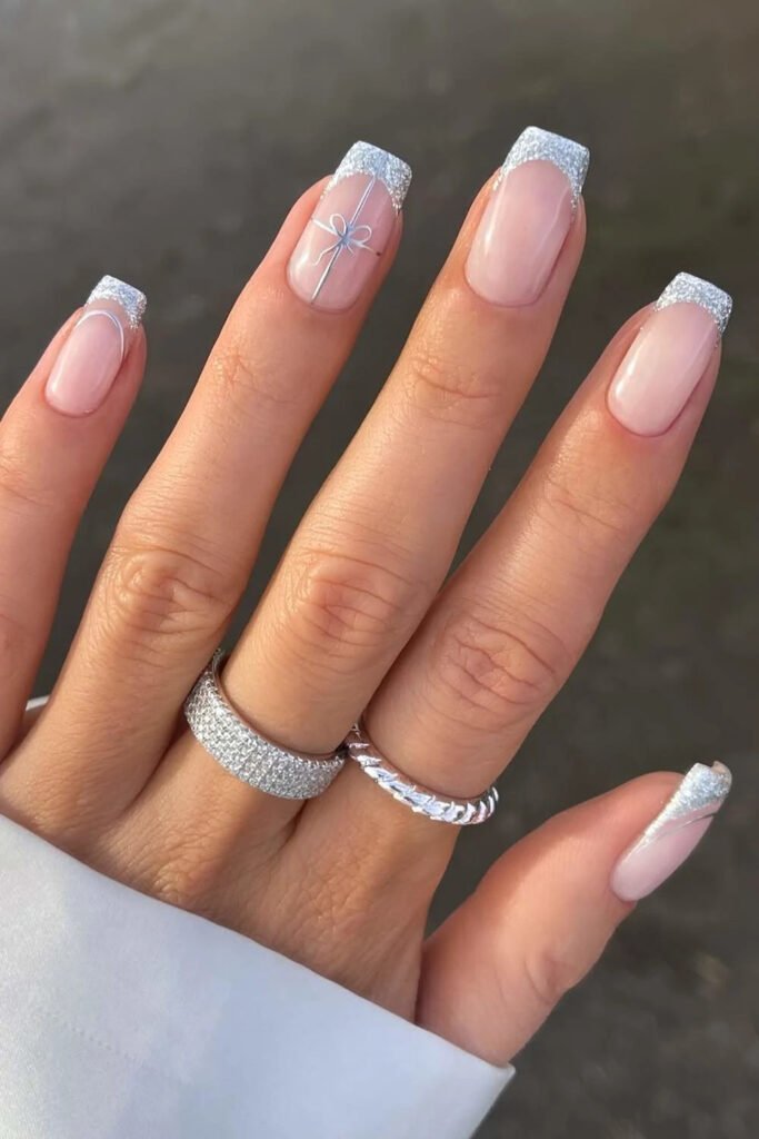 Sheer pink nails with silver chrome French tips