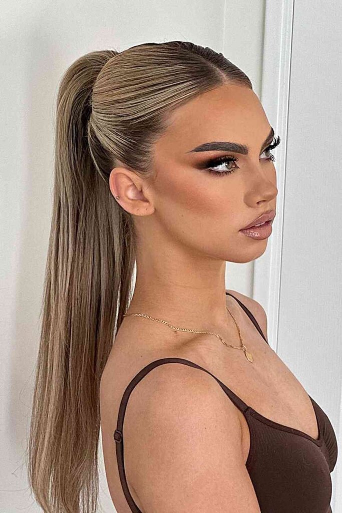 Woman with a sleek high ponytail