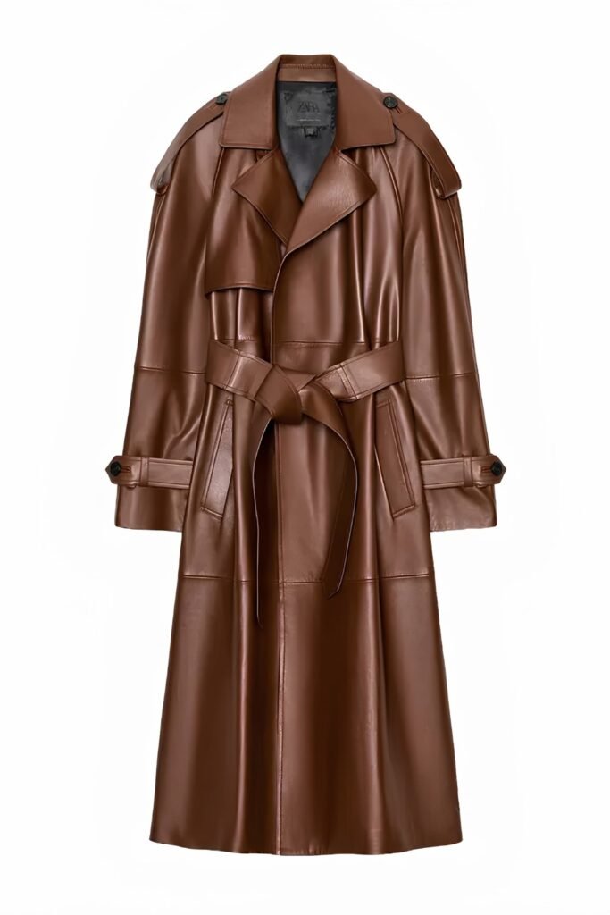 Brown leather belted trench coat shown on a plain background