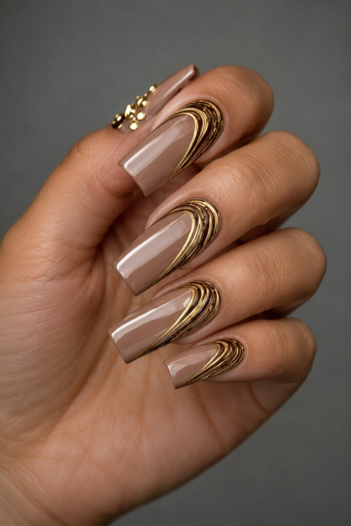 Warm Nude nails With Gold Swirls