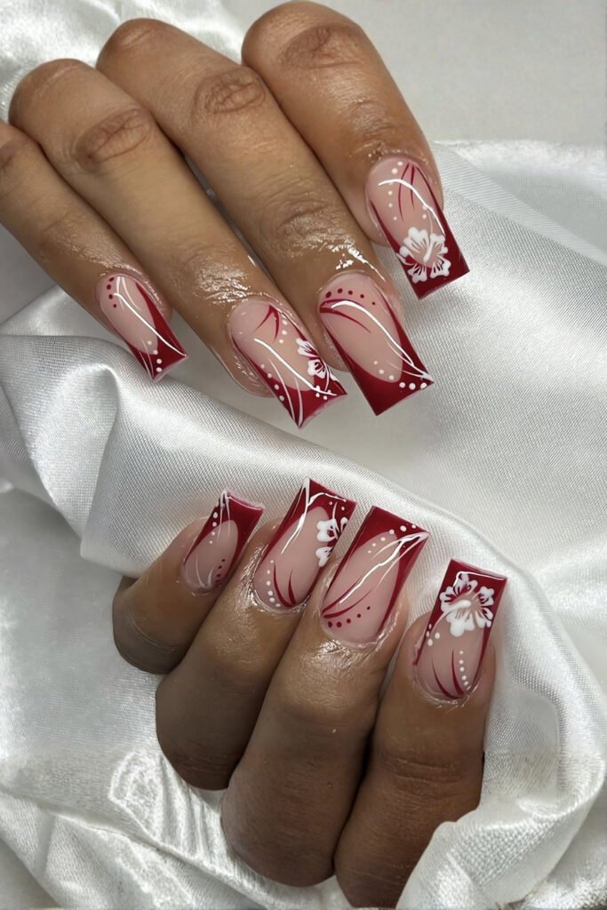 Long square nails with red French tips and fine floral art