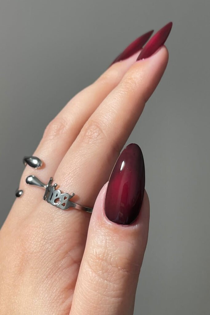 Long almond nails with a cherry-to-mocha ombre