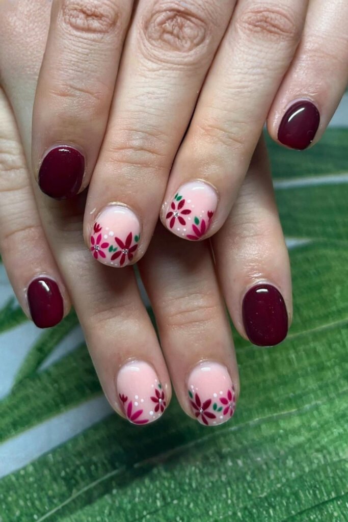 Short nails pairing solid cherry mocha with pink floral accent nails