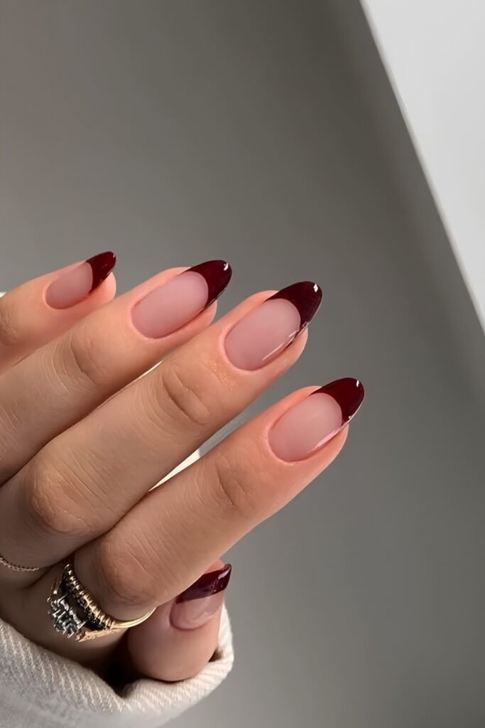 Nude almond nails with cherry mocha French tips