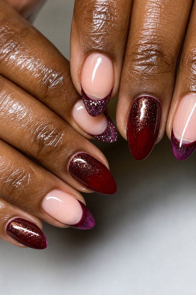 Deep cherry and plum shimmer nails with a nude accent nail