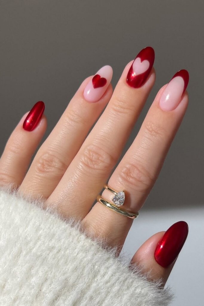 Red French tips and solid red nails with a soft pink base