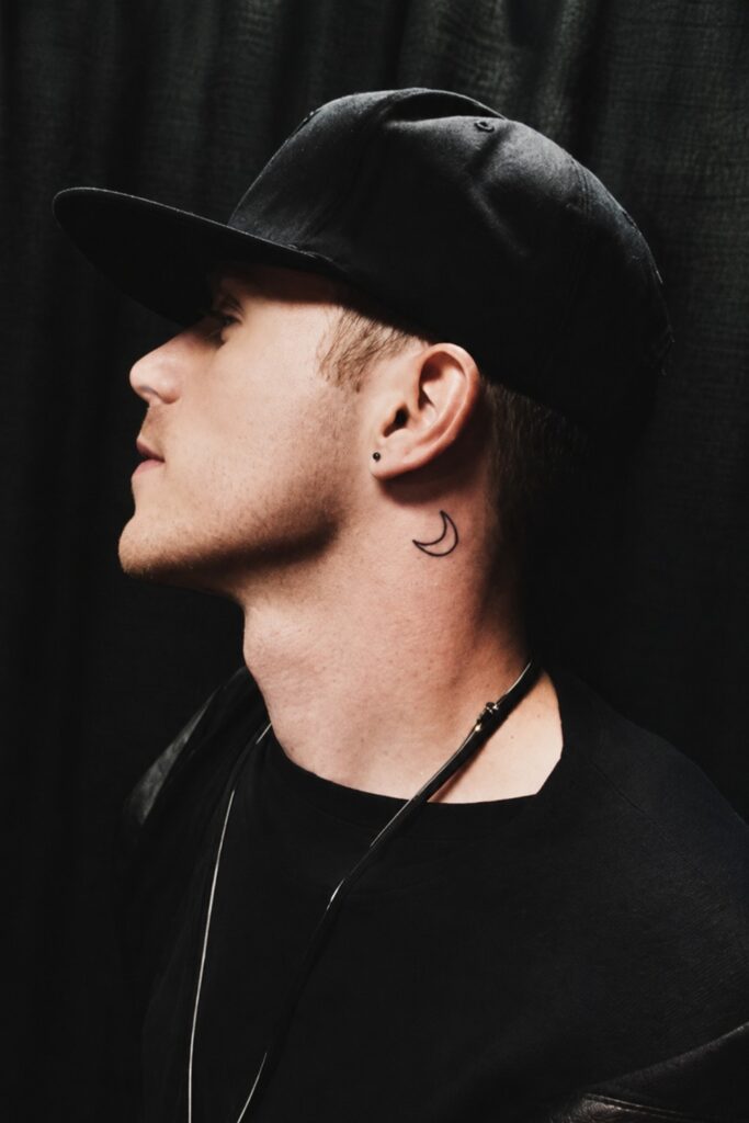 Crescent moon tattoo on a man