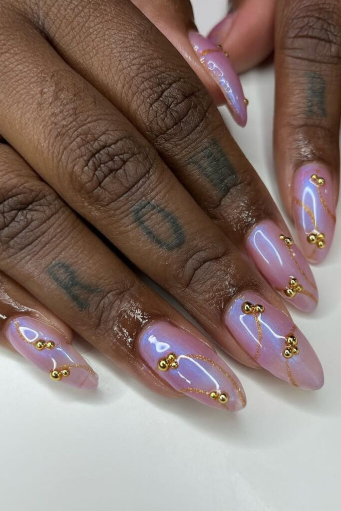 Iridescent nails with gold accents