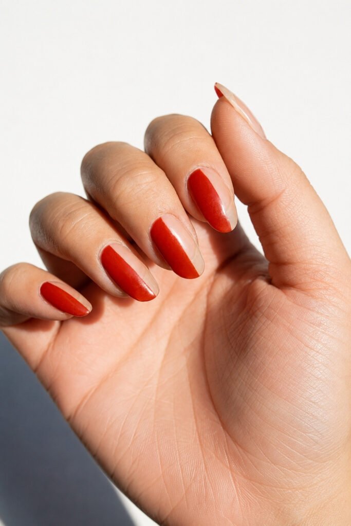 Glossy red nails with negative space details