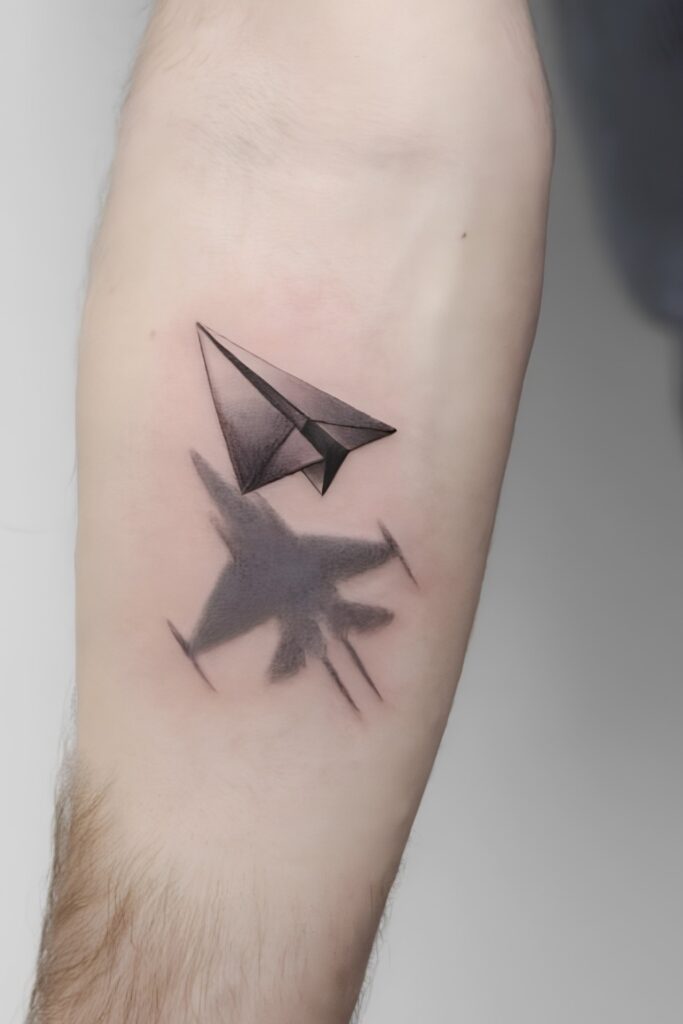Paper plane tattoo on a man