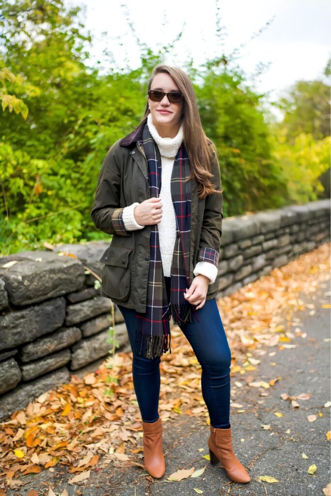 Barn jacket over a fitted turtleneck with slim jeans