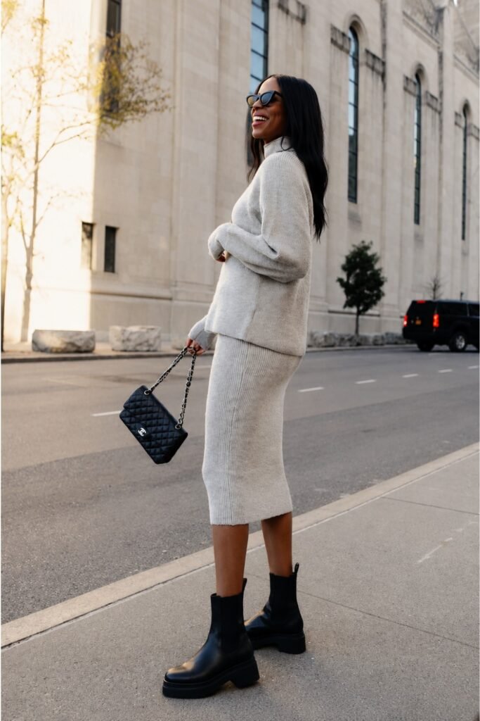 Chelsea boots with an oversized knit and midi skirt