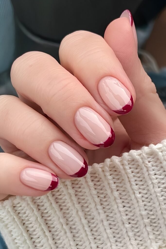 Short nude nails with cranberry French tips