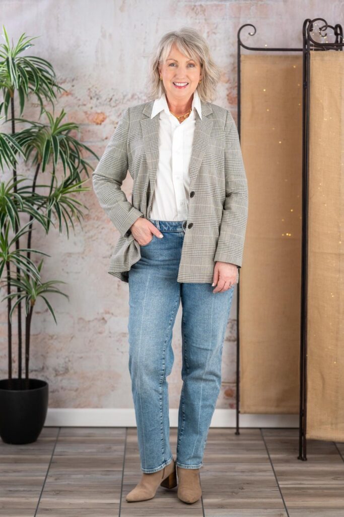 Dark jeans with a white Oxford shirt, blazer and ankle boots