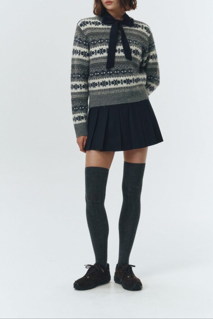Fair Isle sweater with a pleated mini skirt, knee-high socks and loafers