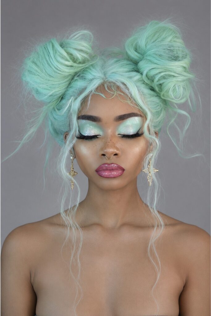 Half-up space buns with straight hair below