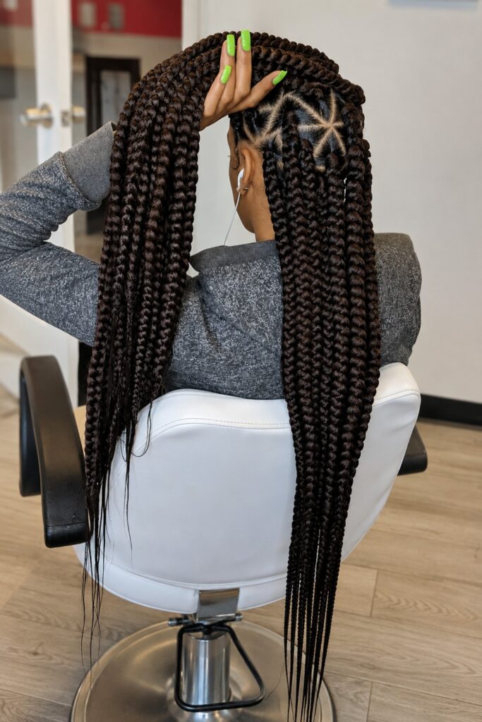 Hip-length jumbo braids with a sculptural part