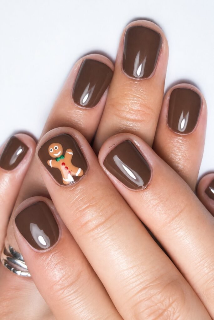 Short mocha brown nails with a gingerbread accent nail